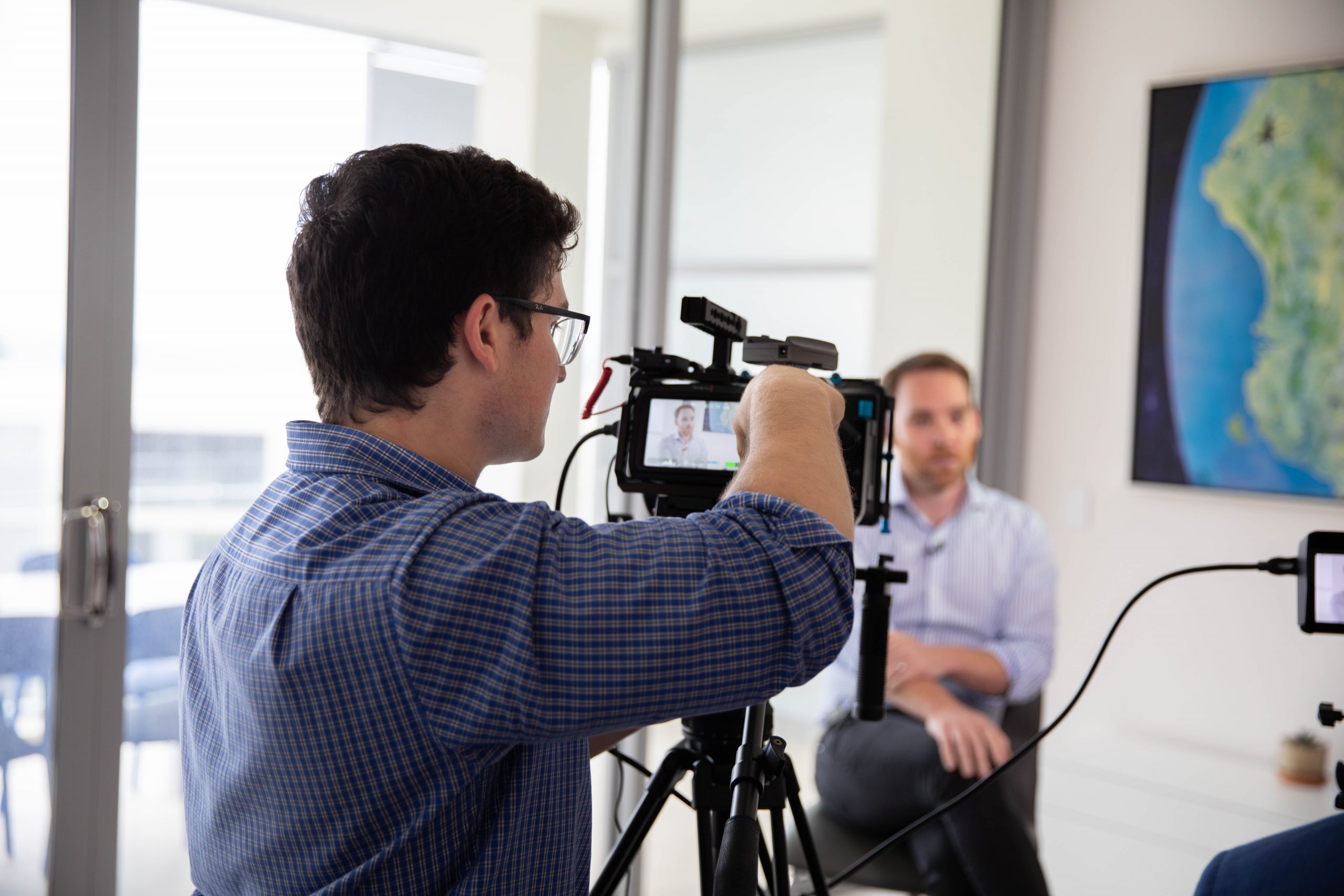 Professional videographer shooting an interview